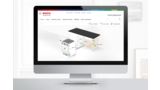 Desktop computer shows Bosch website with precise dimensions for professional dishwasher installation.