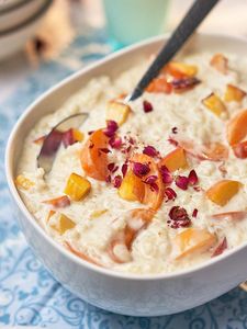 Comfort food by Cookit: rice pudding with apricots, nectarines, peaches and flowers.