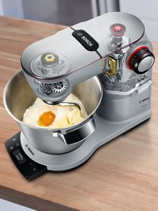 Stand mixer from above with dough in bowl.