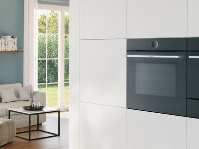 An oven and microwave in a modern living environment.
