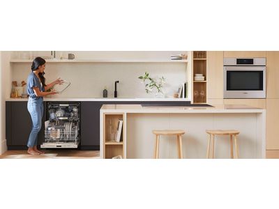 Bosch dishwasher with woman taking out a clean dish