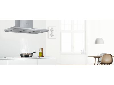 Built in cooker hoods in a white kitchen.