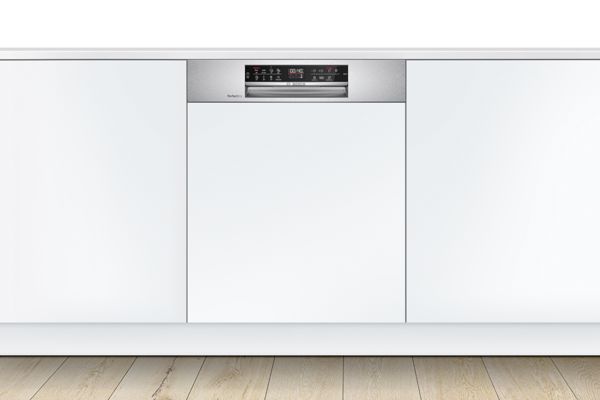 Semi-integrated Bosch dishwasher with a stainless steel control panel, in a modern white kitchen.
