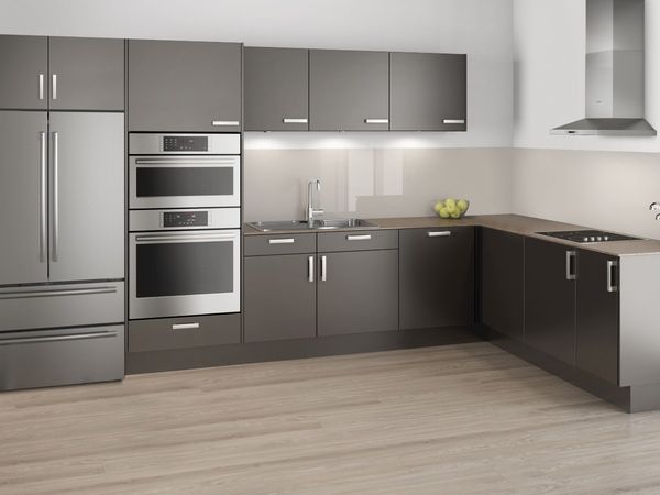 Small modern L-shaped kitchen with graphite cabinet fronts plus a stainless-steel French door fridge and built-in cooking appliances
