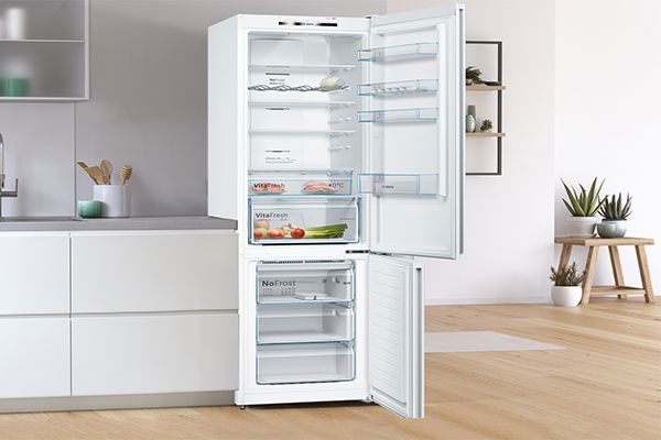 Fully open fridge freezer door showing content inside
