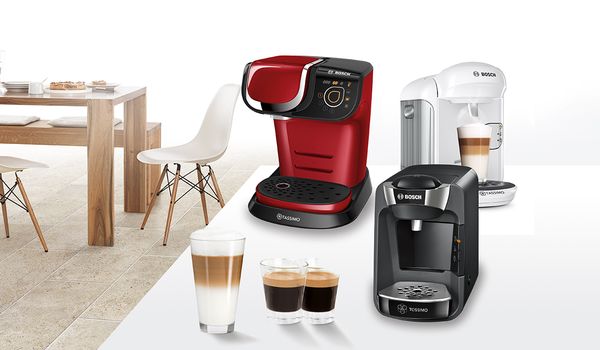 Black, red and white tassimo machine with coffees
