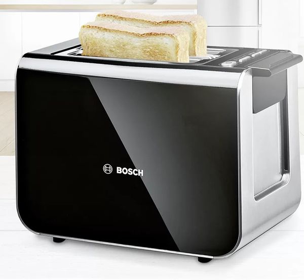 Black and silver toaster with two slices of bread
