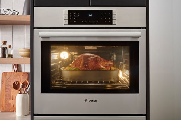 Bosch wall oven roasting a chicken