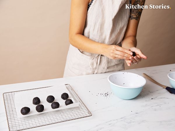 Forming oreo dough into small balls