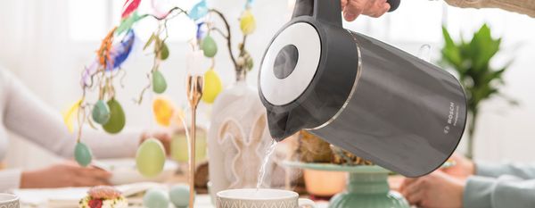 Bosch DesignLine kettle with water hot, tea cup and easter egg