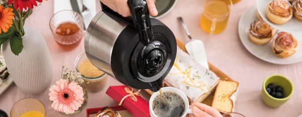 Bosch Styline coffeemaker with coffee flowers cake and tea festive