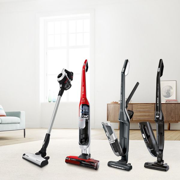 Row of different cordless vacuum cleaners