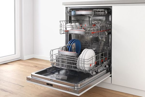 Fully-integrated Bosch dishwasher that is not filled to capacity – perfect for the half load setting.