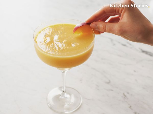 Peach-pineapple wine slushie in wine glass