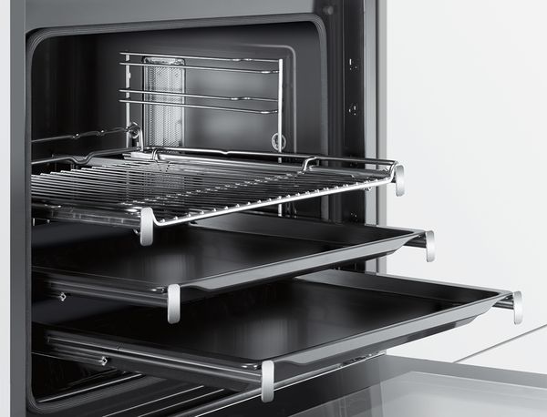 A Bosch oven with an open door showing three telescopic rails. 