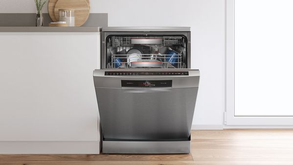 An open dishwasher in the kitchen