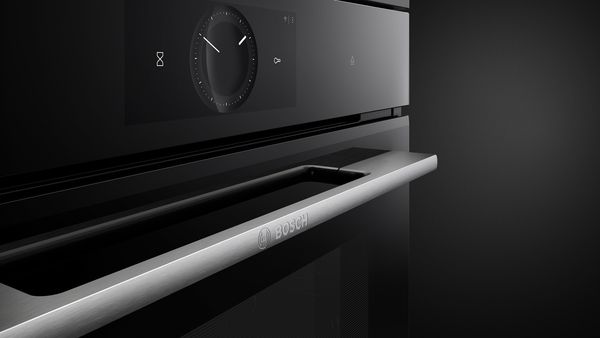 Series 8 oven. Focus on the thin stainless steel-look handle with embossed Bosch logo.