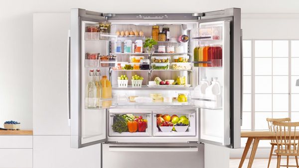 Multi-door fridge freezer with double doors open showing inside contents