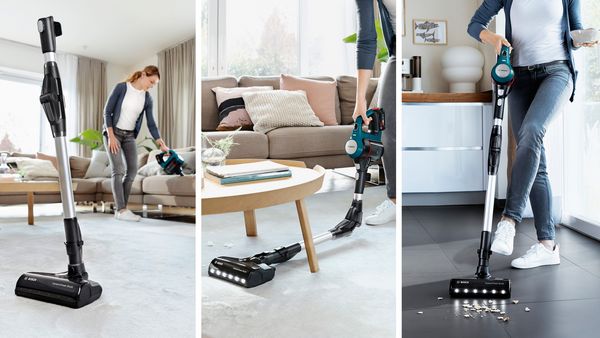 A selection of cordless vacuum cleaners in a living room.