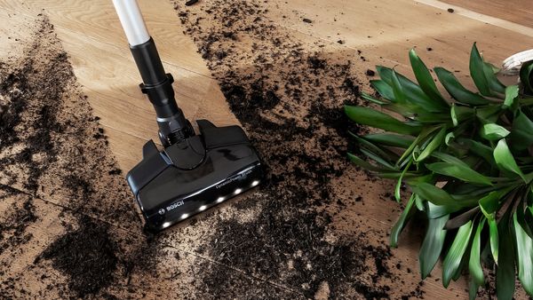 ProPower cleans up dirt from a tipped over house plant.