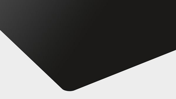 Nærbilde av induksjonsplatetopp med Planto-design fra Bosch Serie 6.