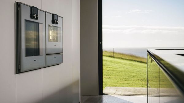 Gaggenau oven, steam oven and warming drawer fitted in Dovecote’s minimalist kitchen layout