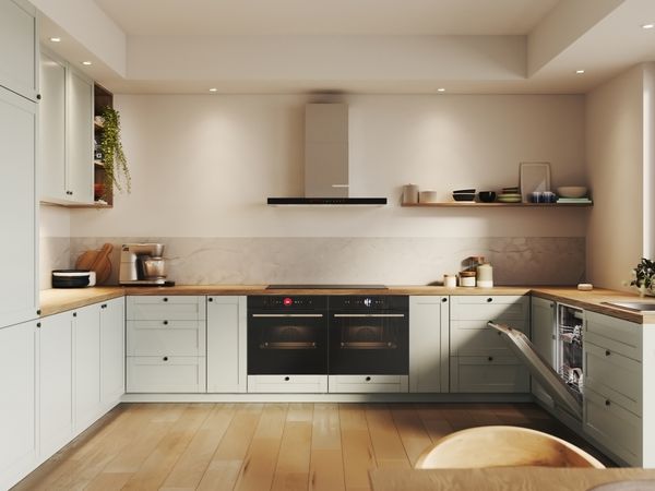 White open plan kitchen with multiple appliances