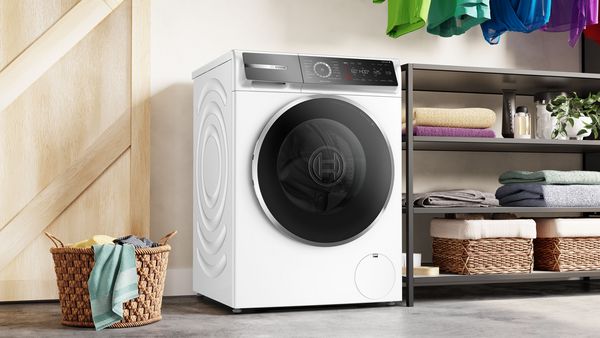 serie 8 wasmachine van Bosch naast wasmand