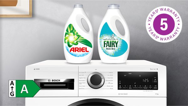 Laundry detergent bottles on top of washing machine