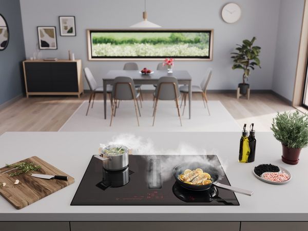 Kies voor een Bosch kookplaat met geïntegreerde afzuiging zodat je geen afzuigkap nodig hebt.