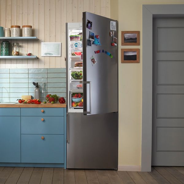 Kitchen with fridge door open showing inside contents