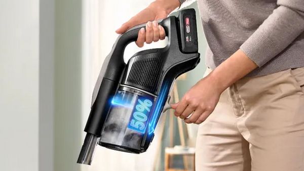 Person holding Unlimited 10 with graphic showing dust compression technology
