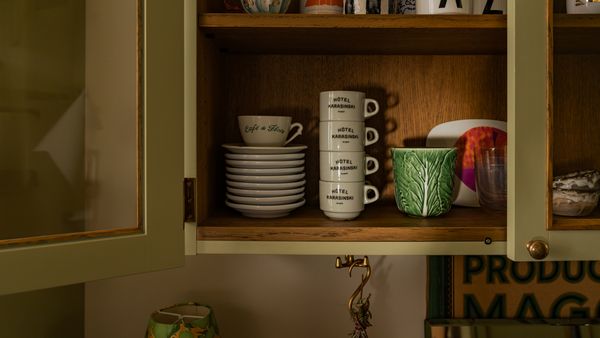 Kitchen cupboard close-up showing items sourced from a variety of places in Atelier Karasinski Archive