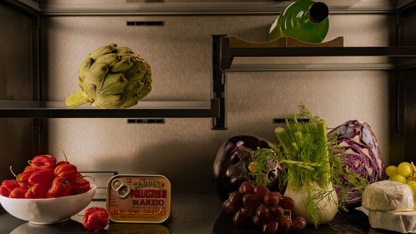 Close-up of the Vario cooling Expressive series appliance with colourful food lit with the appliances lights