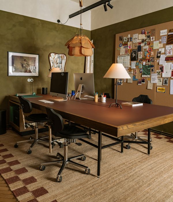 Wide angle of the office area and pin board in Atelier Karasinski Archive