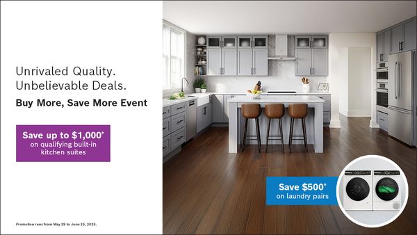 Stylish grey kitchen with a central island and promotional offers for kitchen suites and laundry pairs.
