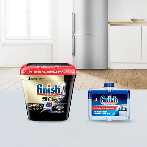 Finish Quantum Ultramax and dishwasher cleaner displayed in a modern kitchen setting.