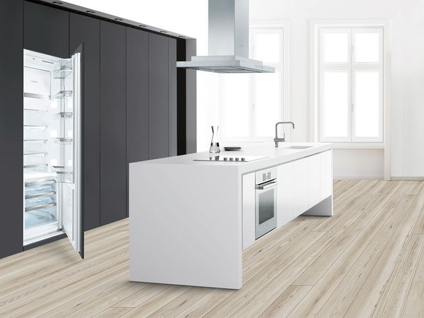 Kitchen with a Bosch integrated fridge-freezer installed with a decor panel