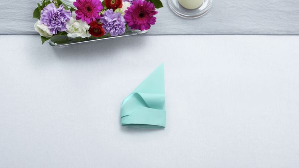 Napkin tip tucked into outer fold