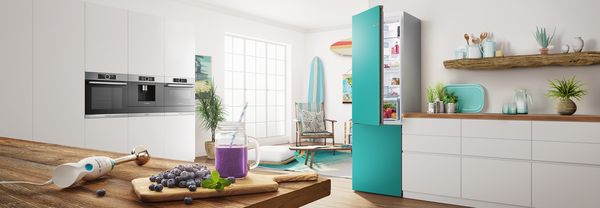 Colourful kitchen in blue with coloured fridge freezer by Bosch.