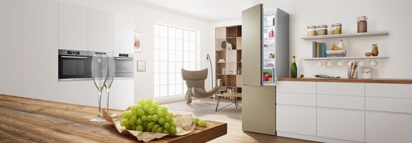 Colourful kitchen in champagne with coloured fridge freezer by Bosch.