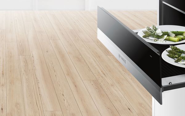 Bosch Warming Drawer open with Food on plates inside