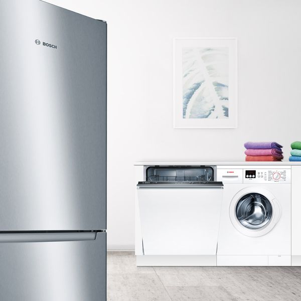 Open Kitchen with Bosch fridge-freezer, dishwasher & washing machine on display.