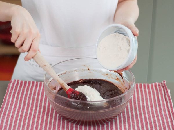 Adding flour to chocolate mix