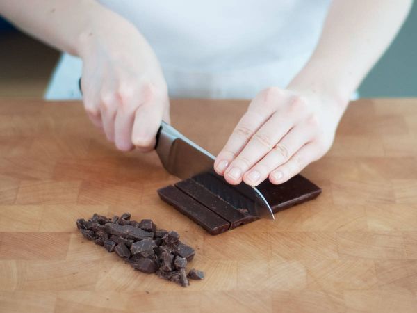 Rougly chopping chocolate with knife