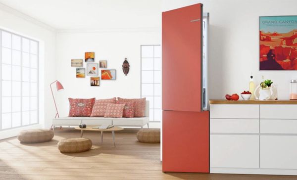 Red accent coloured living room with red variostyle fridge
