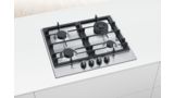 A Bosch Series 6 stainless steel gas hob fitted in the centre of a narrow white island.