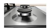 Close-up on a Bosch stainless steel gas hob highlights the smooth surface that is effortless to wipe down.