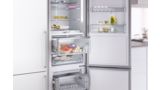 Built-in Bosch fridge-freezer with two open drawers highlights VitaFresh and NoFrost.