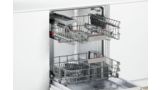 A look inside an empty Bosch dishwasher with two rack system and cutlery basket